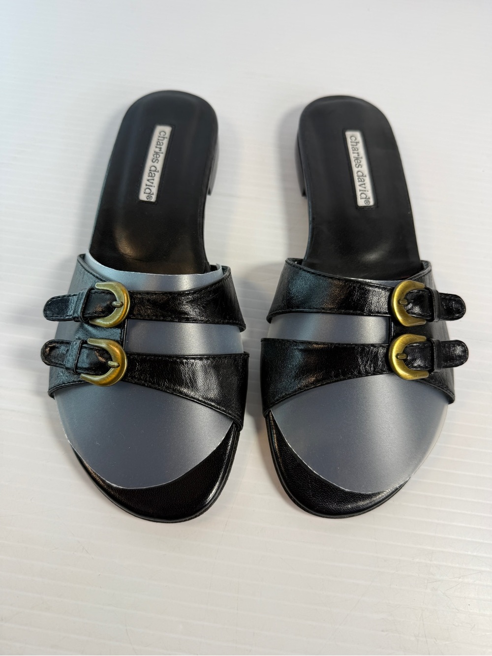 Charles David Black and Gray Slide Mules with Gold Buckles